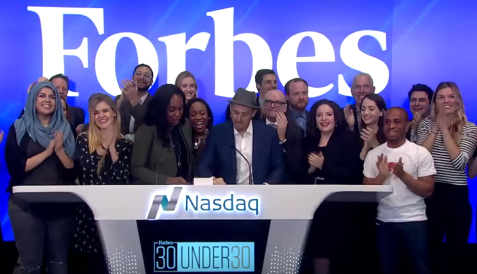 Christopher Gray (on the right in the white T-shirt) was among the Forbes Under 30 winners to ring the Nasdaq opening bell on Monday.