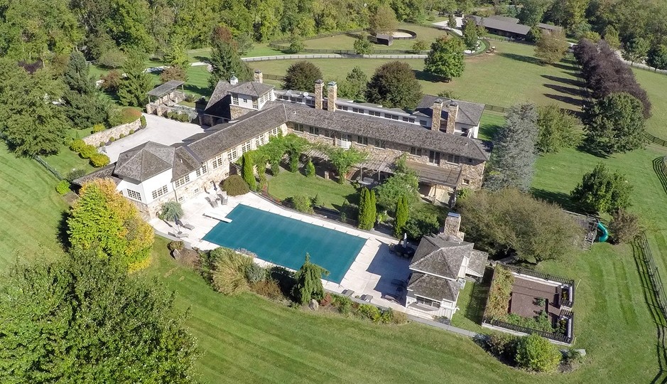 This Pottstown farmhouse has an observatory, pool and stables.