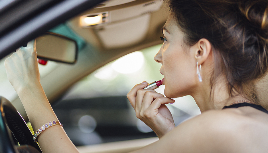 Because sometimes you just have to touch up your lipstick at a red light. | iStockPhoto.com/ArthurHidden.