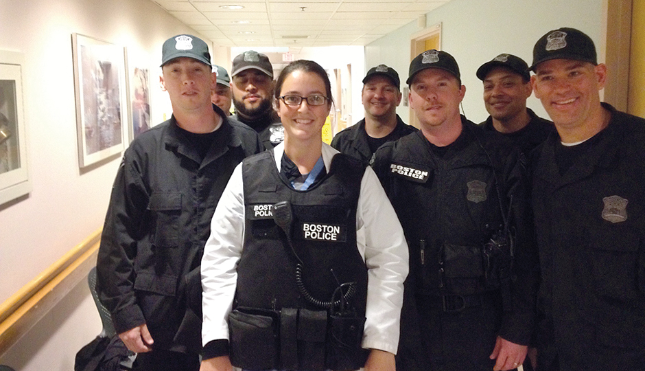 Amy and the Boston police detail after the marathon bombing. Photograph courtesy of Hooman Noorchashm.