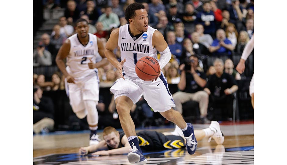 Iowa's Mike Gesell watches as Villanova's Jalen Brunson runs a fast break during the first half of a second-round men's college basketball game in the NCAA Tournament, Sunday, March 20, 2016, in New York.