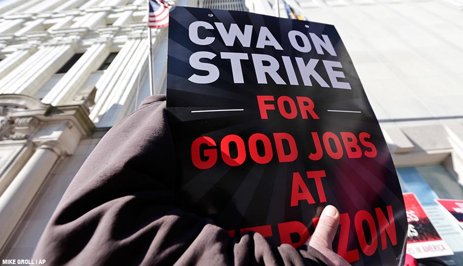 Striking Verizon workers picket outside a Verizon office on Wednesday, April 13, 2016, in Albany, N.Y.