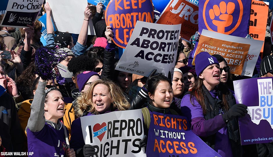 Pro-abortion rights protesters rally outside the Supreme Court in Washington, Wednesday, March 2, 2016. 