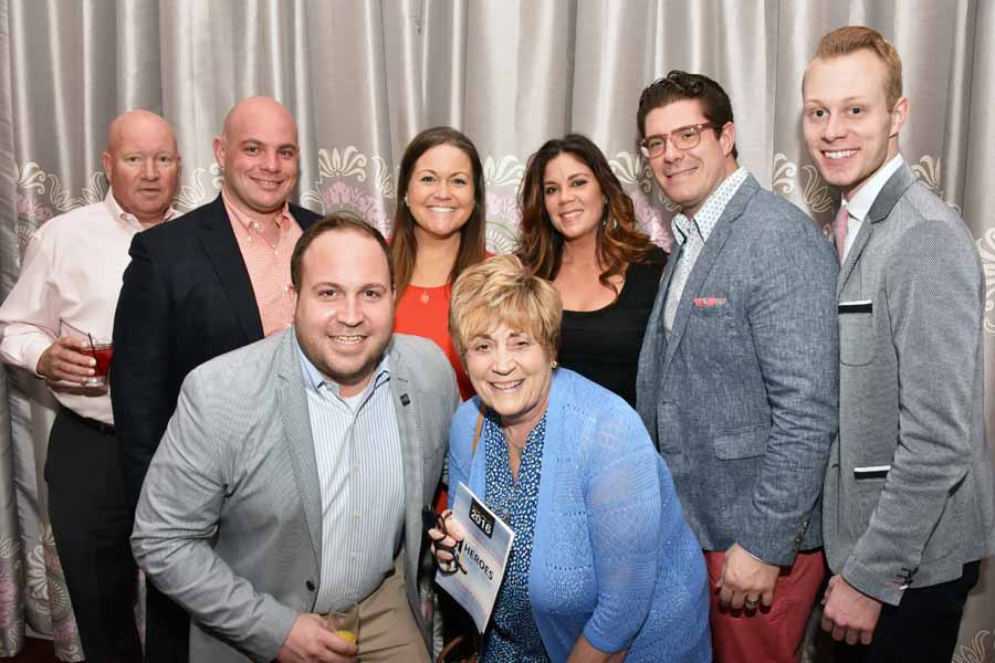 The Team from Table 95 Hospitality which consists of Field House, Tap House and Penn 6, was honored with the Business HERO Award for their longstanding support of many organizations in the LGTBQ community. Tim Adams  (front left) and Puri Garzone (2nd from right at top) accepted the honor on behalf of the group. Photography by Hugh E. Dillon. 