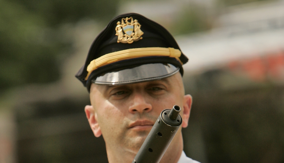 Philadelphia Philadelphia police Lt. Vince Testa holds a confiscated submachine gun at the force's north Philadelphia firing range Wednesday, July 25, 2007. The weapon, which police described as being assembled from a kit in the style of a World War II British Sten gun, was taken along with another weapon and narcotics as two men were arrested in south Philadelphia on Tuesday. (AP Photo/George Widman)