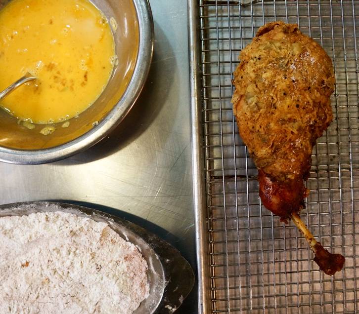 picnic rabbit, potato salad, pickles - front legs are hot fried, hind legs marinated in mustard and herbs, loin marinated in herbs and olive oil to be grilled. grilled potato salad, pickles on the side