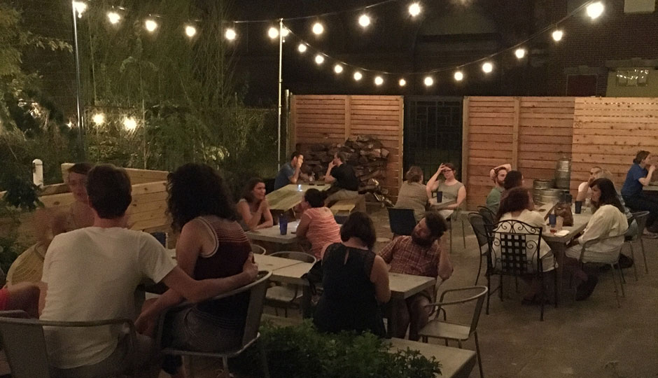 Courtyard under lights at Martha | Photo via Martha