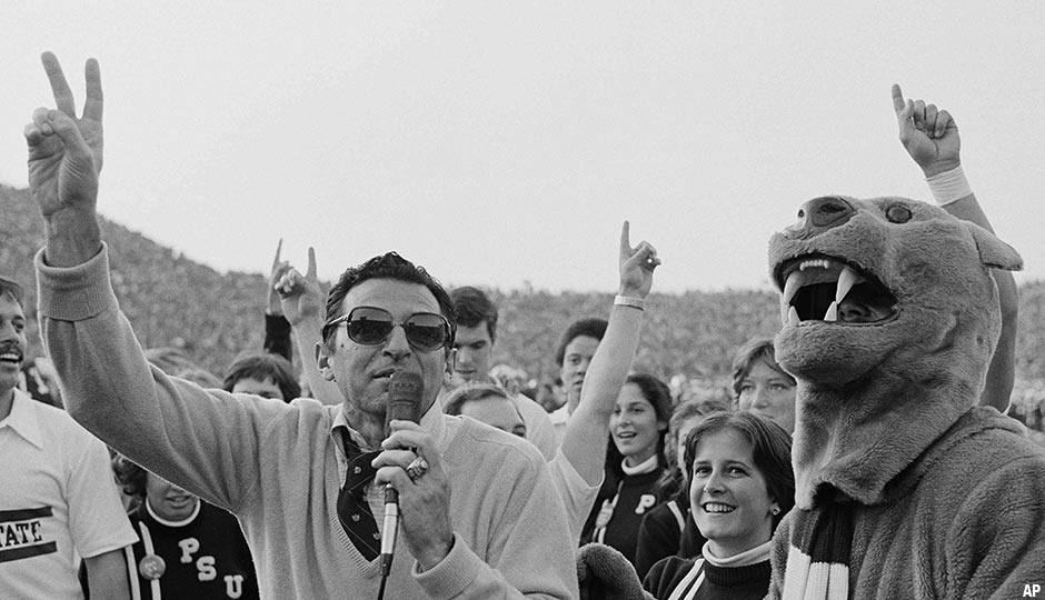 Joe Paterno, Penn State football coach, raises fingers in a victory gesture after Penn State defeated North Carolina State 19-10 at University Park, Pennsylvania, Saturday, Nov. 11, 1978.
