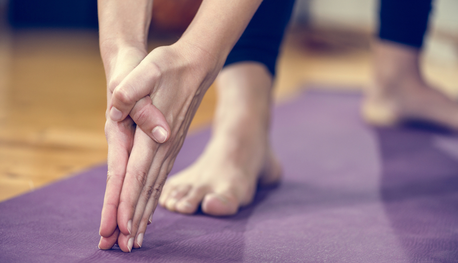 Yoga detail, hands in focus.