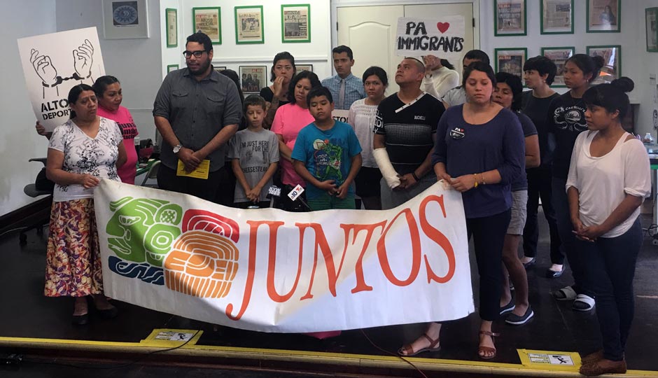 People assemble for a press conference at Juntos in response to today's Supreme Court ruling on immigration