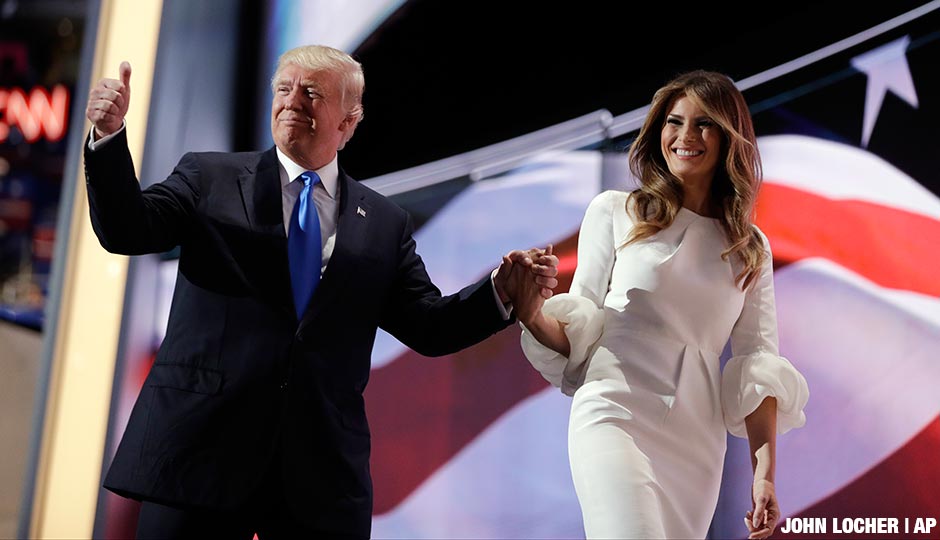 Republican presidential candidate Donald Trump gives his thumb up as he walks off the stage with his wife Melania during the Republican National Convention, Monday, July 18, 2016, in Cleveland.