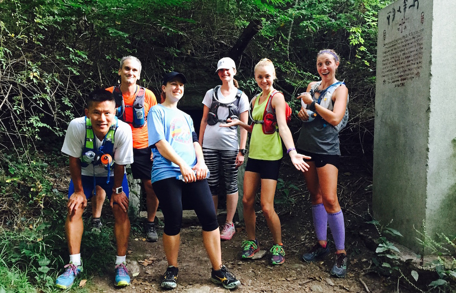 Members of Chasing Trails running group outside Hermit's Cave.