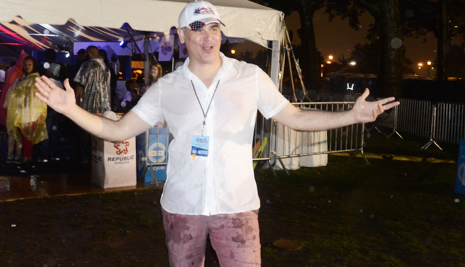 Welcome America CEO Jeff Guaracino in the rain at Philly's 4th of July concert and fireworks. (Photo by HughE Dillon)