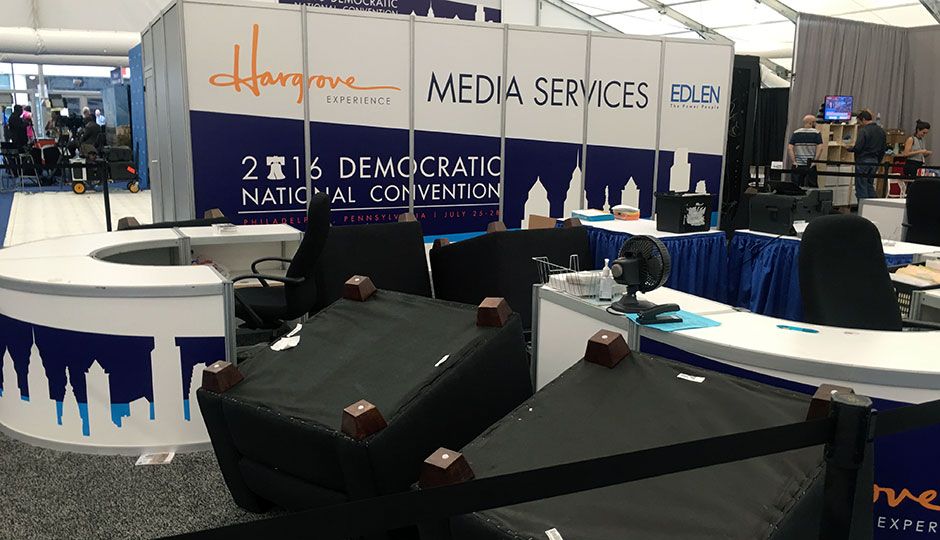 Media services tent photo — several chairs are overturned