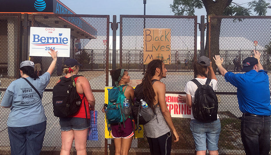Security fence outside the Wells Fargo Center with protesters
