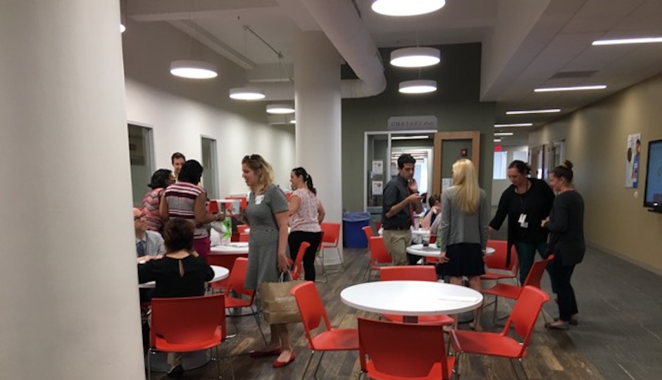Three central common spaces form the "hub" of the "neighborhood" where EPIC@Jeff employees work. The cafe space hosts a wide range of activities, not all of them related to eating.| Photo from KSS Architects