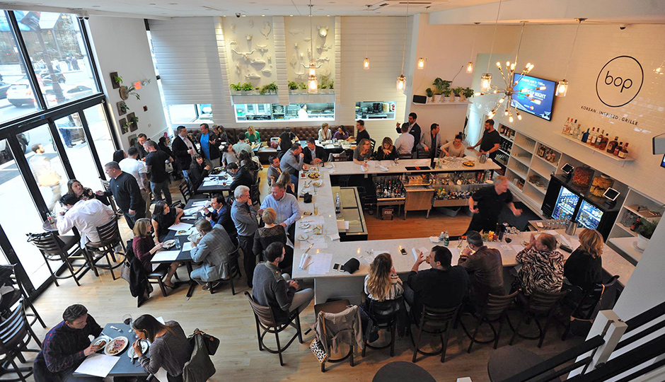 Bop's bar with kitchen in the background | Photo via BOP