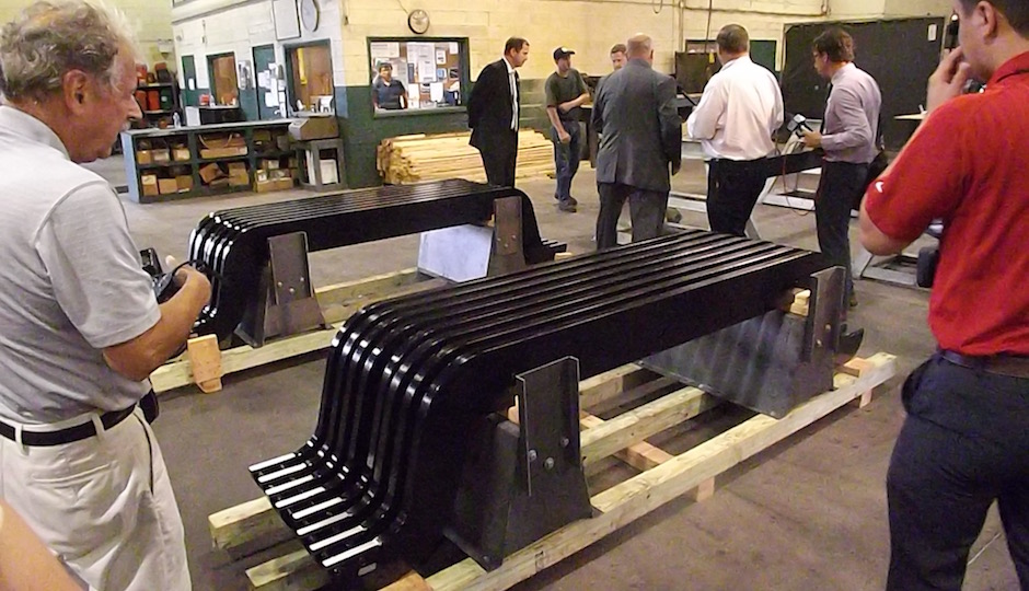 Finished equalizer beams await attachment of their feet at the PennFab plant in Bensalem. | Photos: Sandy Smith; graphics: SEPTA