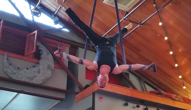 Eric Michaels of Circadium practices acrobatics. He'll be performing on straps at Feastival.  