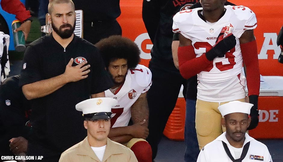 San Francisco 49ers quarterback Colin Kaepernick, middle, kneels during the national anthem before the team's NFL preseason football game against the San Diego Chargers, Thursday, Sept. 1, 2016, in San Diego.