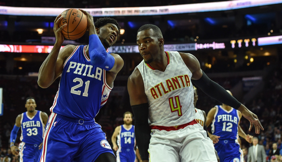 Joel Embiid (14 points) works against Paul Millsap (17 points) in the first quarter of the Sixers 104-72 loss to the Hawks | John Geliebter-USA TODAY Sports