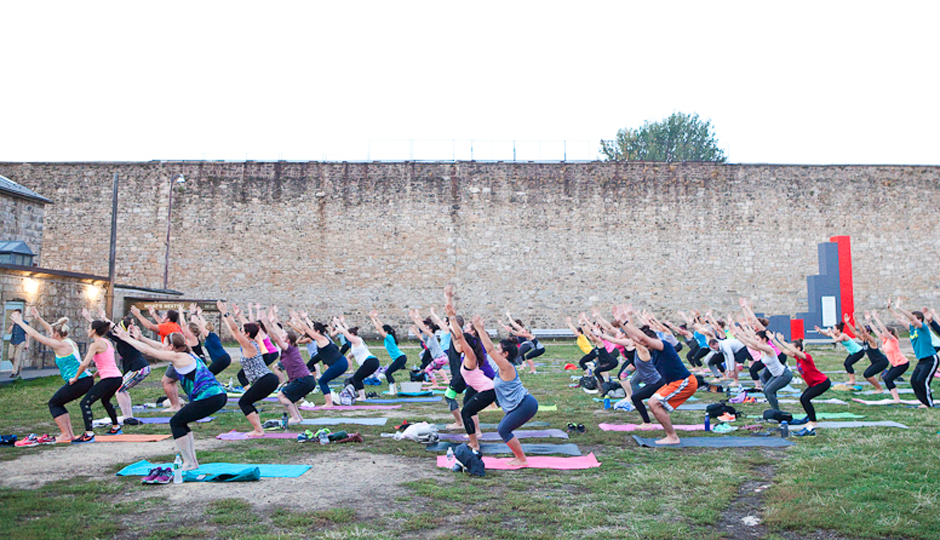 Be Well Philly Underground's Downward Dogs and Drinks at Easter State Penitentiary | Photo by Susan Nam