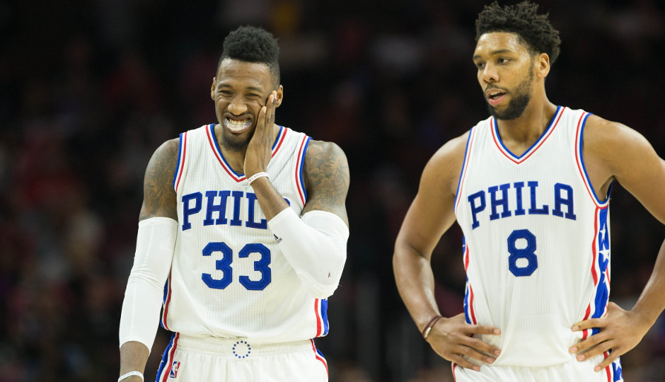 Robert Covington (left) and Jahlil Okafor (right) react after colliding when fighting for a rebound in the second half of Friday night's 105-89 loss to the Chicago Bulls | Bill Streicher-USA TODAY Sports
