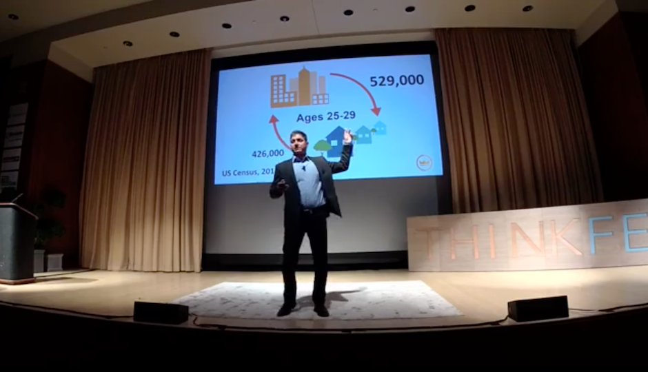 Goldstein with a slide showing Census city-suburb migration data for 25- to 29-year-olds at ThinkFest.