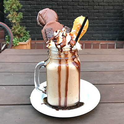 Brotherly Love Shake (Vanilla ice cream, with a Kandy Kake, TastyKake Cupcake, Peanut Chew, Amish pretzel and whipped cream)
