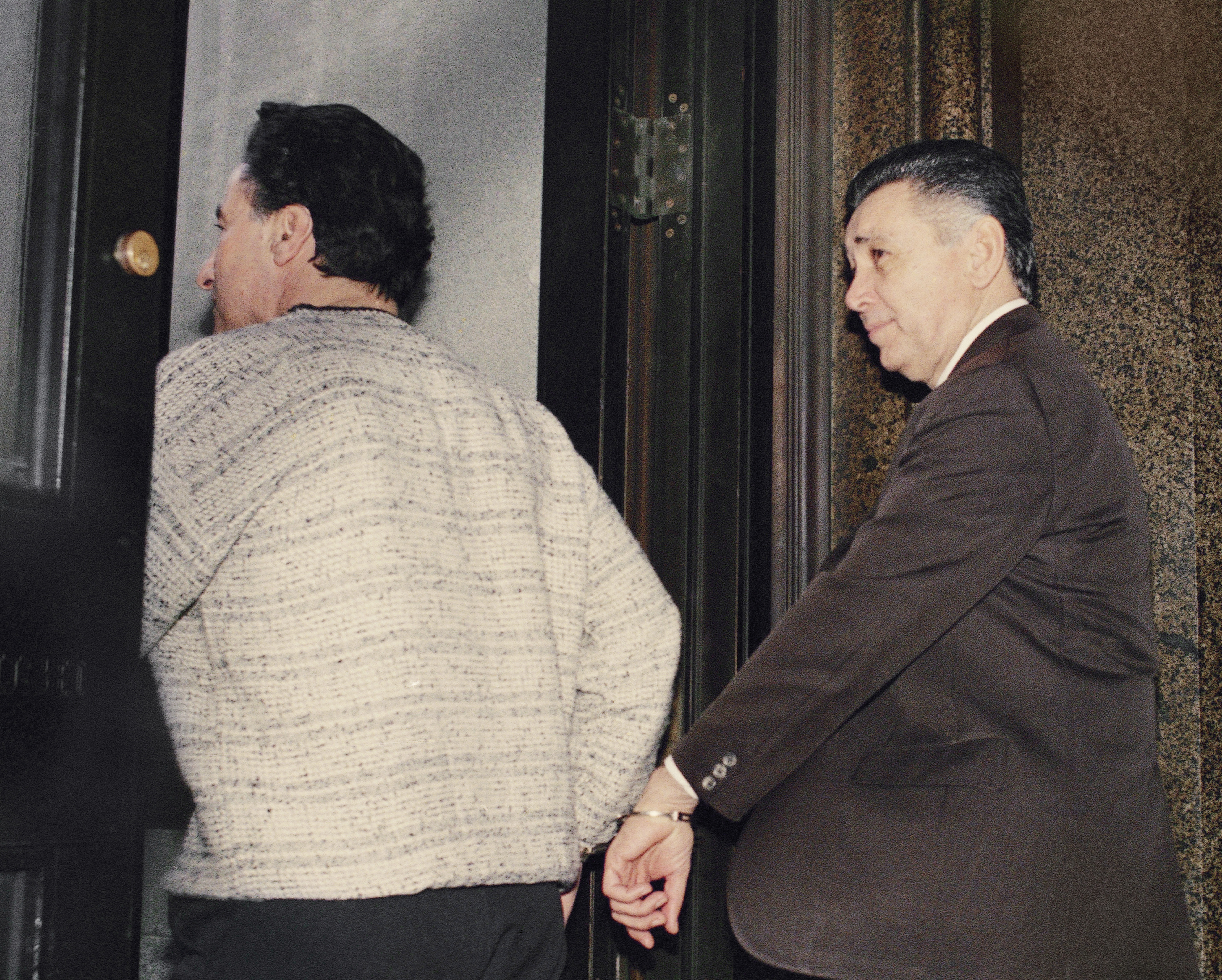 Reputed crime boss Nicodemo Little Nicky Scarfo is led from Philadelphia Common Pleas Court, April 6, 1989, after being sentenced to life in prison along with seven of his associates. The prosecution was seeking the death penalty, but Judge Eugene Clarke announced his decision in the 1985 murder case of gangster Frank D'Alfonso which Scarfo and his associates were found guilty. (AP Photo/Charles Krupa)