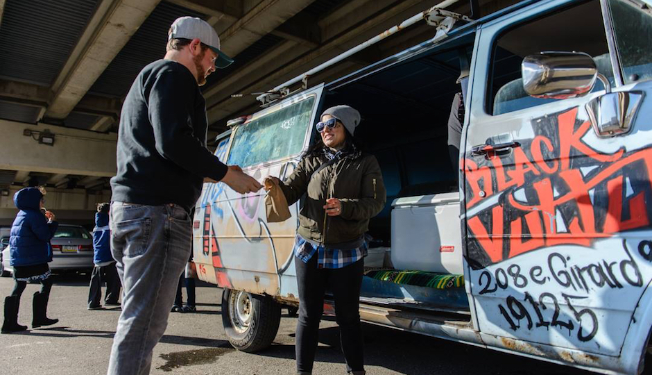 Jennifer Zavala hands over some delicious marijuana-free tamales to a customer just moments before the cops showed up. Photo by Mike Whiter.