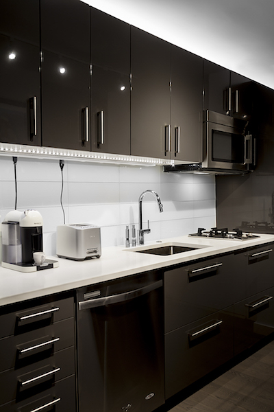 Sexiness and the single kitchen: The galley kitchen is designed to meet the needs of a tenant living solo with its two-burner gas cooktop and extra counter space.