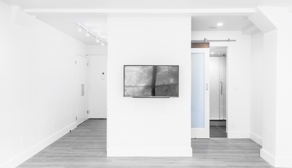 The second unit featured on Zillow was Apt. 613, shown here before Bo Concept came in to furnish it.