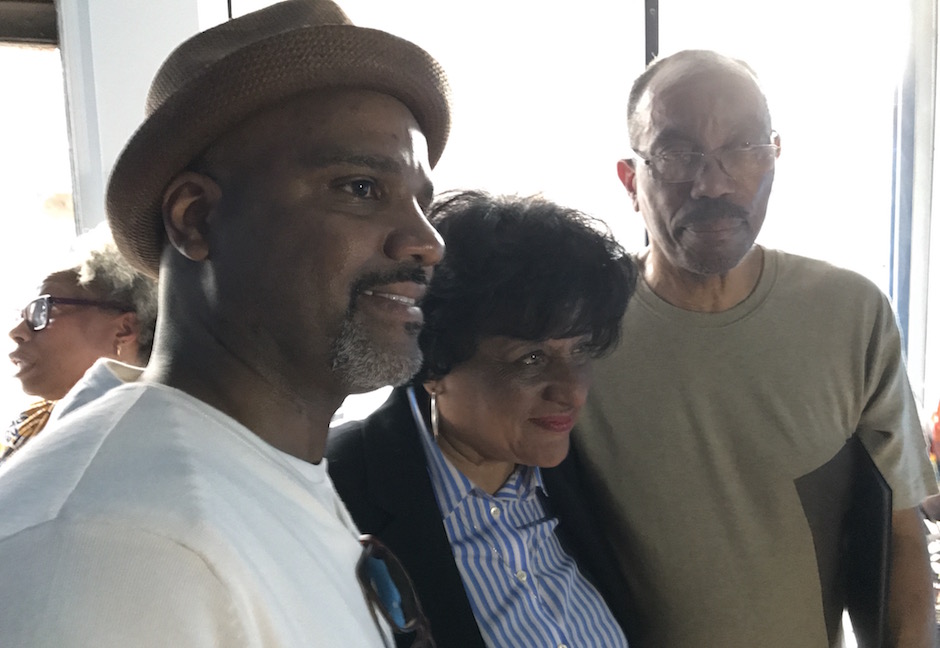 Tyler Martin (left) with Blackwell and Brooks. Martin organized the celebration.
