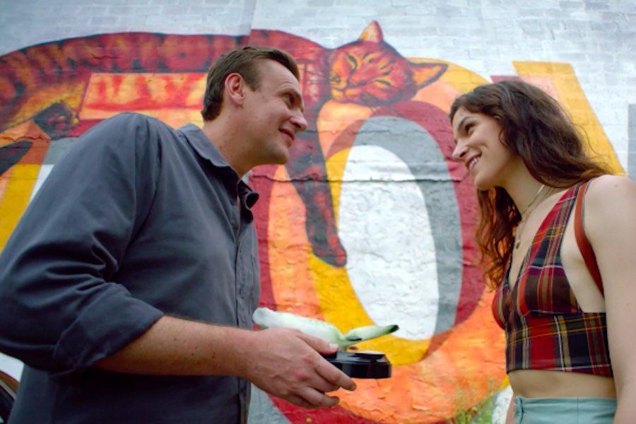 jason segel and dispatches from elsewhere co-star eve lindley in front of the Fishtown cat mural