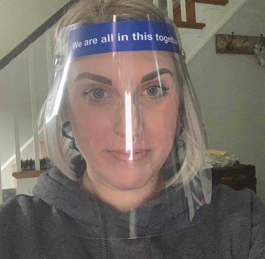 nichole missino in the face shield she bought to wear inside Giovanni's barbershop in Media