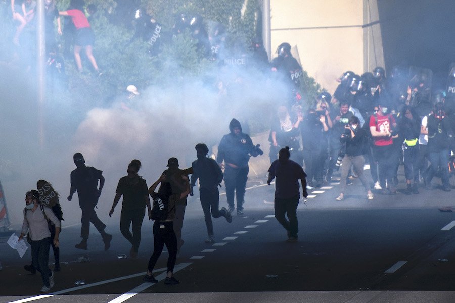 philadelphia police using tear gas on protesters, who are filing a lawsuit over the use of tear gas