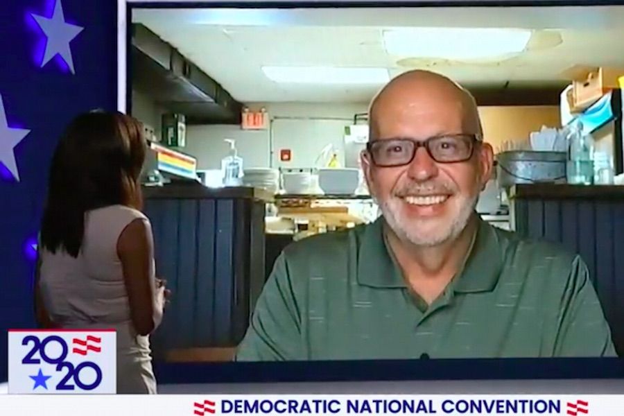 eva longoria speaks to swarthmore restaurant owner scott richardson during DNC day one