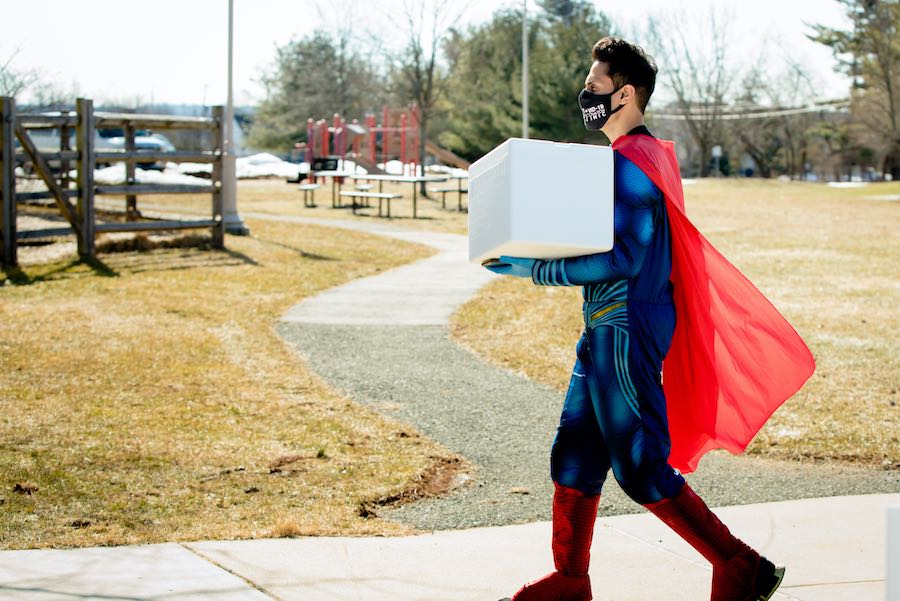 Skippack pharmacist Mayank Amin aka Dr. Mak of Skippack Pharmacy carrying materials for his COVID vaccine clinic