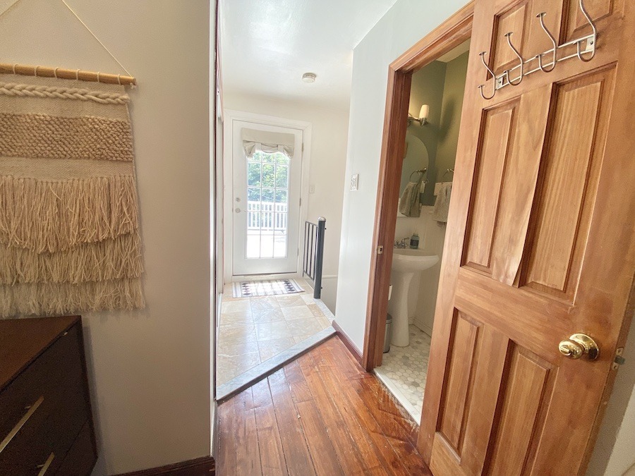 primary suite hall and half bath