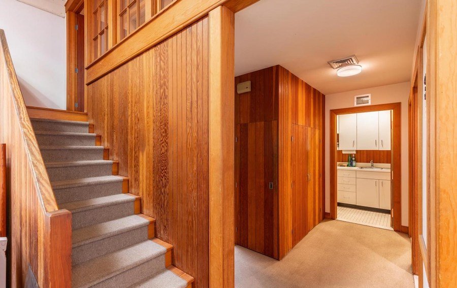 hall to storage room, bathrooms and kitchen