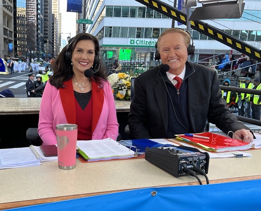dawn stensland and larry mendte behind the mummers broadcast booth