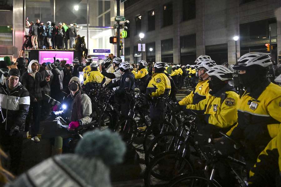 philadelphia police stand watch over eagles fans after the team's crushing loss in the super bowl