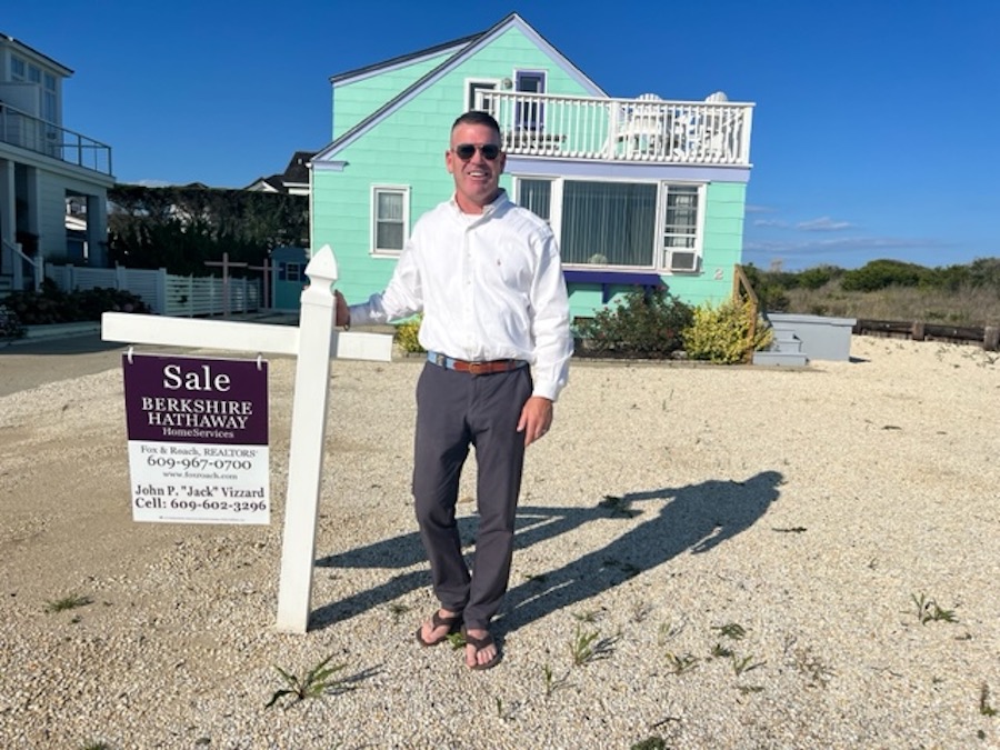 stone harbor oceanside cottage sold jack vizzard in front of house