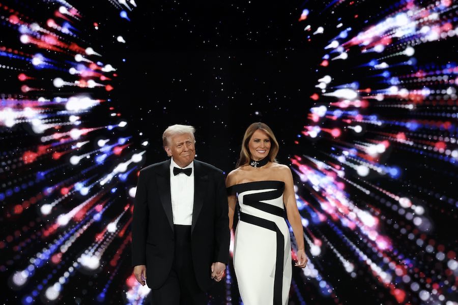 WASHINGTON, DC - JANUARY 20: President Donald Trump walks on stage with his wife First Lady Melania Trump at the Liberty Inaugural Ball on January 20, 2025 in Washington, DC. President DonaldTrump attends some of the inaugural balls after taking the oath as the 47th president. (Photo by Joe Raedle/Getty Images)