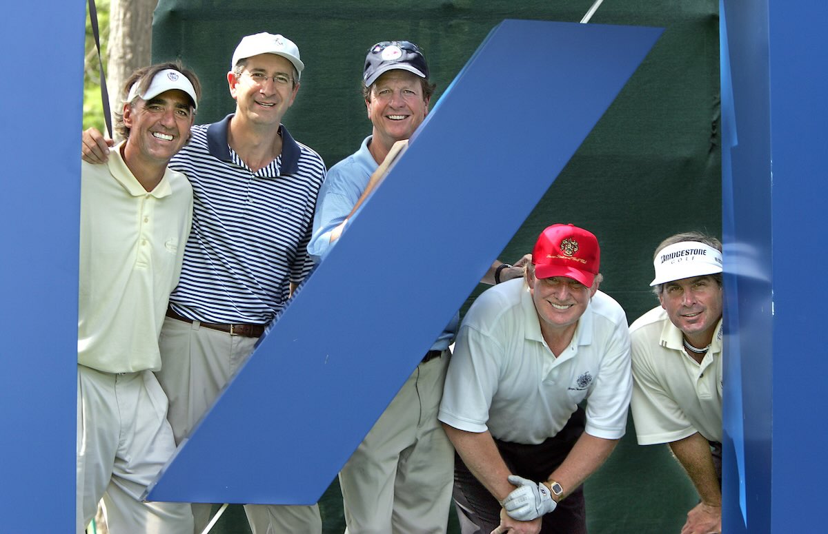 Comcast CEO Brian Roberts (second from left) and then-citizen Donald Trump (second from right) enjoying a round of golf together in Massachusetts during happier times in 2005