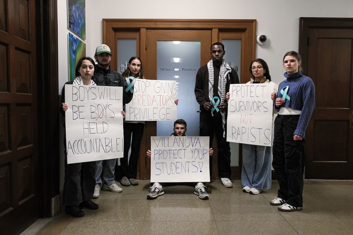 Villanova University students Aly Sivinski, Hope Frantz, Cory Goldstein, Brian Messalti, Marisa Canepa, Akintade Asalu, and Emma Komoroski prepare for Saturday's protest about Juan Eguiguren and sexual assault at Villanova