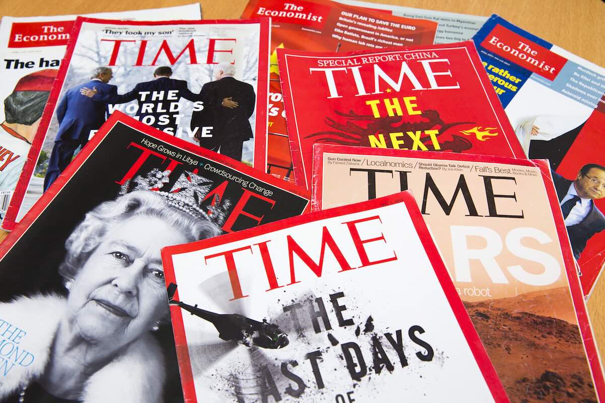 A stack of TIME magazines. The magazine just released its list of the 100 best podcasts of all time.