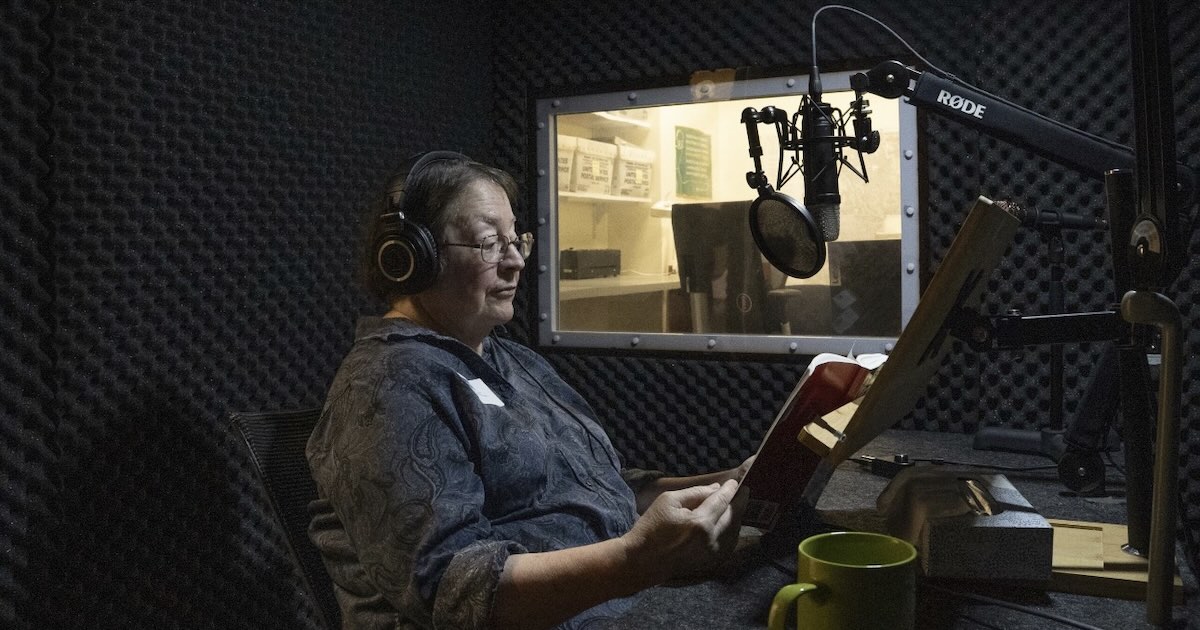A volunteer at LAMP in Philadelphia recording an audiobook